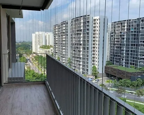 Invisible grill installation on a Mumbai balcony